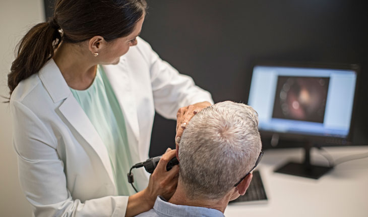 Earwax removal by hearing professional. 