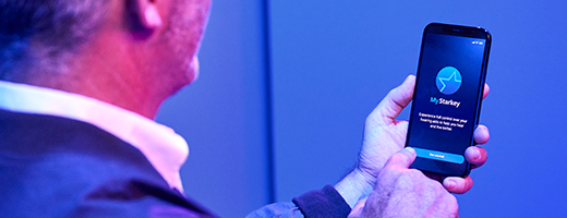 Image of man looking at his My Starkey app