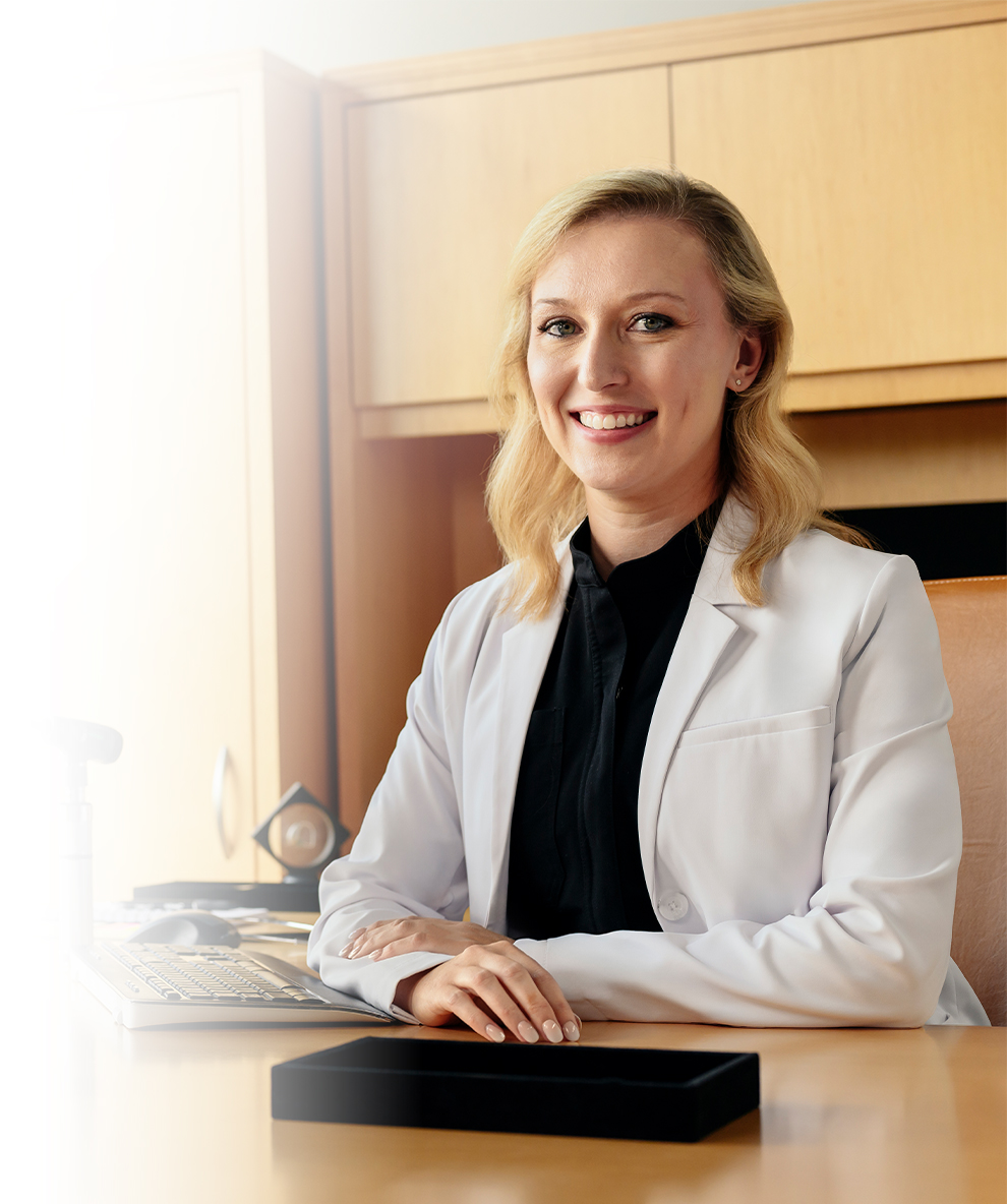 female hearing professional sitting at desk